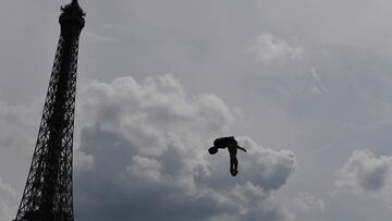 Romania's Constantin Popovici competes during the Red Bull Cliff Diving World Series near the Eiffel Tower in Paris, on June 18, 2023. (Photo by JULIEN DE ROSA / AFP)