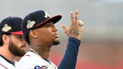 Ronald Acuña Jr of the Atlanta Braves gestures with his World Series ring during the ring ceremony before the game against the Cincinnati Reds.