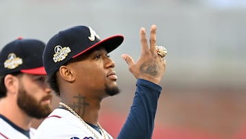 Ronald Acuña Jr of the Atlanta Braves gestures with his World Series ring during the ring ceremony before the game against the Cincinnati Reds.