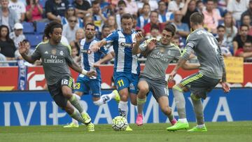 Paco Monta&ntilde;&eacute;s intenta llevarse el bal&oacute;n ante la presi&oacute;n de Marcelo y Kovacic en un partido de Liga BBVA entre Espanyol y Real Madrid.