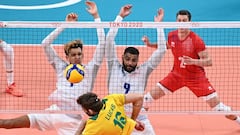 France&#039;s Barthelemy Chinenyeze (L) and Earvin Ngapeth (R) block a shot by Brazil&#039;s Lucas Saatkamp (C) in the men&#039;s preliminary round pool B volleyball match between Brazil and France during the Tokyo 2020 Olympic Games at Ariake Arena in To