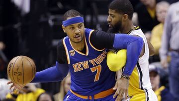 New York Knicks forward Carmelo Anthony (7) works against Indiana Pacers forward Paul George (13) during the second half of an NBA basketball game in Indianapolis, Monday, Jan. 23, 2017. The Knicks defeated the Pacers 109-103. (AP Photo/Michael Conroy)