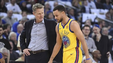 March 8, 2018; Oakland, CA, USA; Golden State Warriors head coach Steve Kerr (left) talks to guard Stephen Curry (30) after an injury against the San Antonio Spurs during the first quarter at Oracle Arena. Mandatory Credit: Kyle Terada-USA TODAY Sports