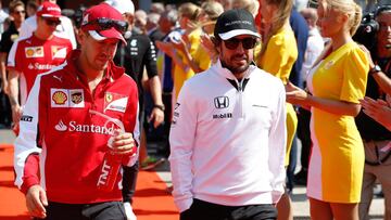 SPA, BELGIUM - AUGUST 23:  Sebastian Vettel of Germany and Ferrari and Fernando Alonso of Spain and McLaren Honda arrive for the drivers&#039; parade before the Formula One Grand Prix of Belgium at Circuit de Spa-Francorchamps on August 23, 2015 in Spa, Belgium.  (Photo by Charles Coates/Getty Images)
 PUBLICADA 15/06/16 NA MA36 3COL