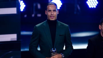 PARIS, FRANCE - FEBRUARY 27: Virgil Van Dijk of Liverpool poses for photos with his trophy of FIFA Men's World 11 during The Best FIFA Football Awards 2022 on February 27, 2023 in Paris, France. (Photo by Marcio Machado/Eurasia Sport Images/Getty Images)