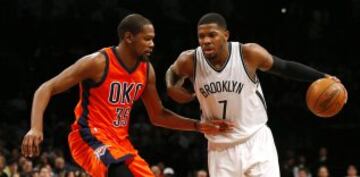 Jan 24, 2016; Brooklyn, NY, USA; Oklahoma City Thunder forward Kevin Durant (35) defends against Brooklyn Nets forward Joe Johnson (7) during second half at Barclays Center. The Nets defeated the Thunder  116-106. Mandatory Credit: Noah K. Murray-USA TODAY Sports