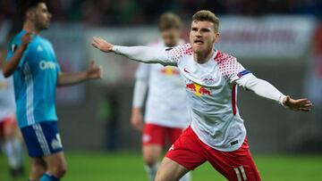 Leipzig's German forward Timo Werner (R) celebrates scoring the opening goal during the UEFA Europa League quarter-final first leg football match RB Leipzig vs Olympique de Marseille (OM) at the RB arena in Leipzig, eastern Germany, on April 5, 2018.