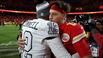 KANSAS CITY, MISSOURI - NOVEMBER 29: Patrick Mahomes #15 of the Kansas City Chiefs hugs Aidan O'Connell #12 of the Las Vegas Raiders after the game at GEHA Field at Arrowhead Stadium on November 29, 2024 in Kansas City, Missouri. Jamie Squire/Getty Images/AFP (Photo by JAMIE SQUIRE / GETTY IMAGES NORTH AMERICA / Getty Images via AFP)
