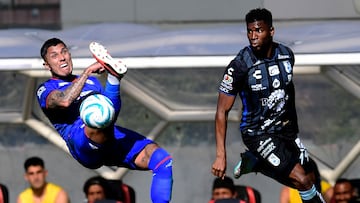 Carlos Salcedo (L) of Cruz Azul vies for the ball with Jose Zuniga (R) of Queretaro during their Mexican Apertura 2023 tournament football match at the Azteca stadium in Mexico City on September 24, 2023. (Photo by CLAUDIO CRUZ / AFP)