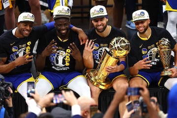 Andre Iguodala #9, Draymond Green #23, Klay Thompson #11 and Stephen Curry #30 after winning the 2022 NBA Finals.