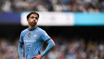 Manchester City's English midfielder #10 Jack Grealish reacts during the English Premier League football match between Manchester City and Brentford at the Etihad Stadium in Manchester, north west England, on September 14, 2024. (Photo by Oli SCARFF / AFP) / RESTRICTED TO EDITORIAL USE. No use with unauthorized audio, video, data, fixture lists, club/league logos or 'live' services. Online in-match use limited to 120 images. An additional 40 images may be used in extra time. No video emulation. Social media in-match use limited to 120 images. An additional 40 images may be used in extra time. No use in betting publications, games or single club/league/player publications. /