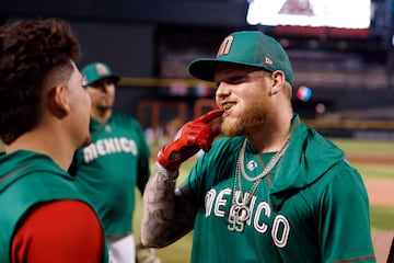 PHOENIX, ARIZONA - MARCH 10: Alex Verdugo #27 of Team Mexico points to his teeth during a workout before the start of the World Baseball Classic at Chase Field on March 10, 2023 in Phoenix, Arizona.   Chris Coduto/Getty Images/AFP (Photo by Chris Coduto / GETTY IMAGES NORTH AMERICA / Getty Images via AFP)