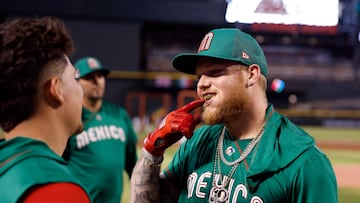PHOENIX, ARIZONA - MARCH 10: Alex Verdugo #27 of Team Mexico points to his teeth during a workout before the start of the World Baseball Classic at Chase Field on March 10, 2023 in Phoenix, Arizona.   Chris Coduto/Getty Images/AFP (Photo by Chris Coduto / GETTY IMAGES NORTH AMERICA / Getty Images via AFP)
