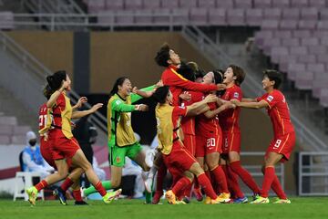 China's players celebrate their win in the AFC Women's Asian Cup against South Korea.