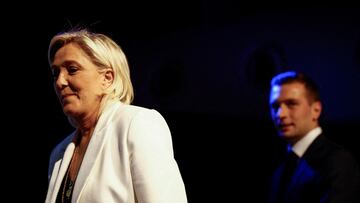 FILE PHOTO: Jordan Bardella, President of the French far-right National Rally (Rassemblement National - RN) party and head of the RN list for the European elections, and Marine Le Pen, President of the French far-right National Rally party parliamentary group, take the stage to address party members after the polls closed during the European Parliament elections, in Paris, France, June 9, 2024. REUTERS/Sarah Meyssonnier/File Photo
