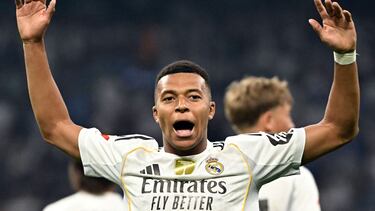 Real Madrid's French forward #10 Kylian Mbappe celebrates scoring the opening goal from the penalty spot during the Spanish league football match between Real Madrid CF and CA Osasuna at Santiago Bernabeu Stadium in Madrid on August 19, 2025. (Photo by Javier SORIANO / AFP)