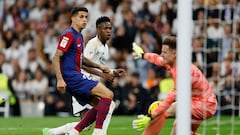 Barcelona's Portuguese defender #02 Joao Cancelo (L) challenges Real Madrid's Brazilian forward #07 Vinicius Junior as he attempts to score during the Spanish league football match between Real Madrid CF and FC Barcelona at the Santiago Bernabeu stadium in Madrid on April 21, 2024. (Photo by OSCAR DEL POZO / AFP)