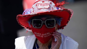 Betty Chu adjusts her MAGA face mask before listening to the US Secretary of State speak at the Richard Nixon Presidential Library, July 23, 2020, in Yorba Linda, California. (Photo by Ashley Landis / POOL / AFP)