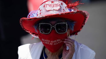 Betty Chu adjusts her MAGA face mask before listening to the US Secretary of State speak at the Richard Nixon Presidential Library, July 23, 2020, in Yorba Linda, California. (Photo by Ashley Landis / POOL / AFP)