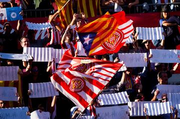 Supporters wave flags of Girona FC and of Catalonia during the La Liga match between Girona and Real Madrid at Estadi de Montilivi on October 29, 2017 in Girona, Spain