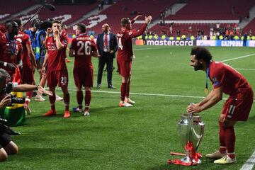 Liverpool's Mohamed Salah poses with the Champions League trophy in Madrid.