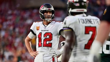 TAMPA, FLORIDA - SEPTEMBER 25: Tom Brady #12 of the Tampa Bay Buccaneers talks with Leonard Fournette #7 of the Tampa Bay Buccaneers after missing the two point conversion against the Green Bay Packers during the fourth quarter in the game at Raymond James Stadium on September 25, 2022 in Tampa, Florida. (Photo by Julio Aguilar/Getty Images)