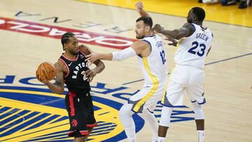 Jun 5, 2019; Oakland, CA, USA; Toronto Raptors forward Kawhi Leonard (2) looks to pass while Golden State Warriors center Andrew Bogut (12) and forward Draymond Green (23) defend  during the second quarter in game three of the 2019 NBA Finals at Oracle Arena. Mandatory Credit: Kyle Terada-USA TODAY Sports