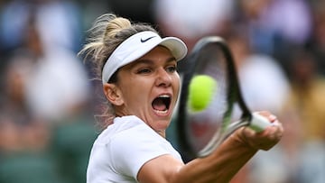 (FILES) Romania's Simona Halep returns the ball to Spain's Paula Badosa during their round of 16 women's singles tennis match on the eighth day of the 2022 Wimbledon Championships at The All England Tennis Club in Wimbledon, southwest London, on July 4, 2022. Former world number one and two-time Grand Slam singles champion Simona Halep has been given a four-year suspension from tennis following breaches of the sport's anti-doping programme, the International Tennis Integrity Agency said on September 12, 2023. The 31-year-old Romanian was provisionally suspended last October 2022 after testing positive for the banned substance roxadustat and was charged with a separate second anti-doping breach in May "relating to irregularities in her athlete biological passport". (Photo by Glyn KIRK / AFP) / RESTRICTED TO EDITORIAL USE