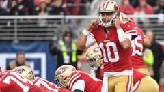 (FILES) In this file photo taken on December 24, 2017  Jimmy Garoppolo #10 of the San Francisco 49ers signals to his team during their NFL game against the Jacksonville Jaguars at Levi&#039;s Stadium in Santa Clara, California.   
 The San Francisco 49ers