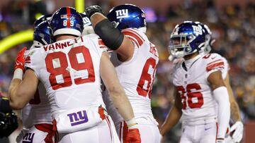 Dec 18, 2022; Landover, Maryland, USA; New York Giants running back Saquon Barkley (26) celebrates with teammates after scoring a touchdown against the Washington Commanders during the second quarter at FedExField. Mandatory Credit: Geoff Burke-USA TODAY Sports