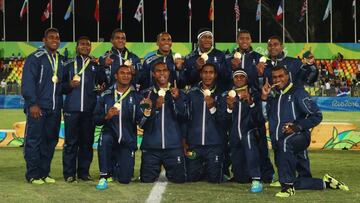 RIO DE JANEIRO, BRAZIL - AUGUST 11:  Gold medalists Fiji pose during the medal ceremony for the Men&#039;s Rugby Sevens on Day 6 of the Rio 2016 Olympics at Deodoro Stadium on August 11, 2016 in Rio de Janeiro, Brazil.  (Photo by Mark Kolbe/Getty Images)