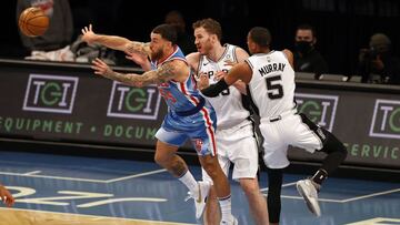 NEW YORK, NEW YORK - MAY 12: Mike James #55 of the Brooklyn Nets passes the ball as Jakob Poeltl #25 and Dejounte Murray #5 of the San Antonio Spurs defend in the first quarter at Barclays Center on May 12, 2021 in the Brooklyn borough of New York City.NOTE TO USER: User expressly acknowledges and agrees that, by downloading and or using this photograph, User is consenting to the terms and conditions of the Getty Images License Agreement. Elsa/Getty Images/AFP
== FOR NEWSPAPERS, INTERNET, TELCOS & TELEVISION USE ONLY ==