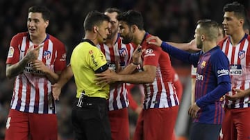 Costa remonstrates with referee Jesús Gil Manzano after being shown a straight red card at the Camp Nou.