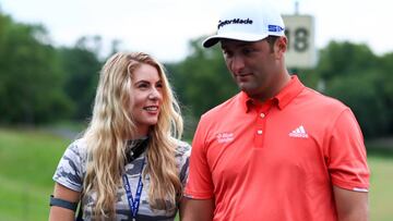 Jul 19, 2020; Dublin, Ohio, USA; Kelley Cahill (left) talks with husband Jon Rahm (right) after he wins The Memorial Tournament at Muirfield Village Golf Club. Mandatory Credit: Aaron Doster-USA TODAY Sports