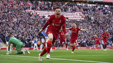 Liverpool's Andrew Robertson celebrates after scoring his sides first goal during the English Premier League soccer match between Liverpool and Everton at Anfield stadium in Liverpool, England, Sunday, April 24, 2022. (Peter Byrne/PA via AP)