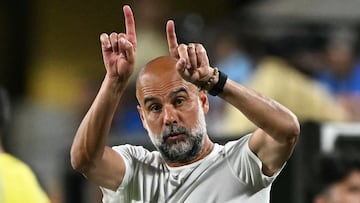 (FILES) Manchester City's Spanish head coach Pep Guardiola gestures during the FIFA Club World Cup 2025 round of 16 football match between England's Manchester City and Saudi's Al-Hilal at the Camping World stadium in Orlando on June 30, 2025. Manchester City, which has amassed championships, domestic cups and even a Champions League title over the last decade, ended last season without any trophies. As Pep Guardiola enters his tenth season, can he lead the club back to success? (Photo by PATRICIA DE MELO MOREIRA / AFP)