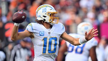 CLEVELAND, OHIO - OCTOBER 09: Justin Herbert #10 of the Los Angeles Chargers attempts a pass during the fourth quarter against the Cleveland Browns at FirstEnergy Stadium on October 09, 2022 in Cleveland, Ohio. Jason Miller/Getty Images/AFP
