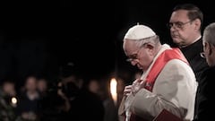 VATICAN CITY, VATICAN - APRIL 15: Pope Francis leads the Way of the Cross, Via Crucis at Rome's Colosseum, on April 15, 2022 in Rome, Italy. The traditional Via Crucis returned on Good Friday evening to the Colosseum in Rome for the first time since 2019, a hiatus of nearly three years. The highlight of the meditations came in the 13th Station, which saw two women carry the cross together: Albina hails from Russia and Irina from Ukraine. (Photo by Alessandra Benedetti - Corbis/Corbis via Getty Images)