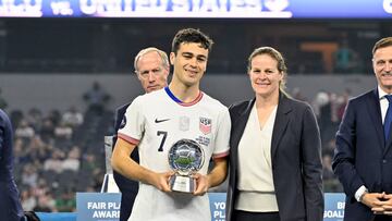 Mar 24, 2024; Arlington, Texas, USA; United States forward Gio Reyna (7) receives the best player award after the Concacaf Nations League Final between the United States and Mexico at AT&T Stadium. Mandatory Credit: Jerome Miron-USA TODAY Sports