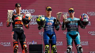 MotoGP - Portuguese Grand Prix - Algarve International Circuit, Portimao, Portugal - November 9, 2025 Italtrans Racing Team's Diogo Moreira celebrates on the podium after winning the Moto2 race with second placed Red Bull KTM Ajo's Collin Veijer and third placed CFMOTO Inde Aspar Team's David Alonso REUTERS/Marcelo Del Pozo