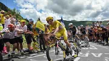 (FILES) UAE Team Emirates team's Slovenian rider Tadej Pogacar wearing the overall leader's yellow jersey (C) cycles ahead of Team Visma - Lease a Bike team's Danish rider Jonas Vingegaard (2nd L), Red Bull - BORA - hansgrohe team's Slovenian rider Primoz Roglic and Soudal Quick-Step team's Belgian rider Remco Evenepoel wearing the best young rider's white jersey (rear) in the ascent of Pas de Peyrol (Puy Mary) during the 11th stage of the 111th edition of the Tour de France cycling race, 211 km between �vaux-les-Bains and Le Lioran, in the Massif Central mountains of central France, on July 10, 2024. (Photo by Marco BERTORELLO / AFP)