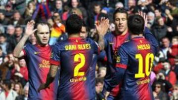 El delantero del F.C.Barcelona, Cristian Tello (2d), celebra con sus compa&ntilde;eros, Andr&eacute;s Iniesta (i), Dani &Aacute;lves (2i), y Lionel Messi (d), su gol conseguido frente al Getafe, durante el partido correspondiente a la jornada 23 de la liga disputado hoy en el Camp Nou de Barcelona.