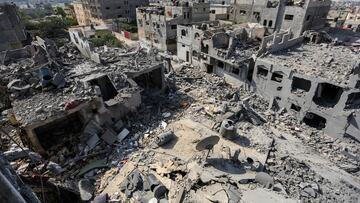 KHAN YUNIS, GAZA - OCTOBER 23: General view of buildings which were destroyed during Israeli air raids in the southern Gaza Strip on October 23, 2023 in Khan Yunis, Gaza. Gazans are evacuating to the south as advised by the Israeli government, ahead of an expected Israeli ground offensive. Israel has sealed off Gaza, leaving the entire population without fuel, water or aid, and launched sustained retaliatory air strikes, which have killed more than 2,000 people and some 400,000 displaced, after a large-scale attack by Hamas. On October 7, the Palestinian militant group Hamas launched a surprise attack on Israel from Gaza by land, sea, and air, killing over 1,300 people and wounding around 2,800. Israeli soldiers and civilians have also been taken hostage by Hamas and moved into Gaza. The attack prompted a declaration of war by Israeli Prime Minister Benjamin Netanyahu and the announcement of an emergency wartime government. (Photo by Ahmad Hasaballah/Getty Images)