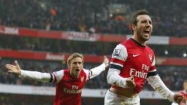 Cazorla y Monreal celebran un tanto con el Arsenal.