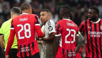 Real Madrid's French forward #09 Kylian Mbappe(2L) gestures to AC Milan's German defender #28 Malick Thiaw during the UEFA Champions League, league phase day 4 football match between Real Madrid CF and AC Milan at the Santiago Bernabeu stadium in Madrid on November 5, 2024. (Photo by Pierre-Philippe MARCOU / AFP)