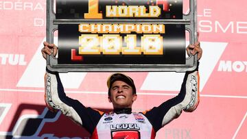 Repsol Honda Team Spanish rider Marc Marquez celebrates on the podium of the MotoGP Japanese Grand Prix at Twin Ring Motegi circuit in Motegi, Tochigi prefecture on October 21, 2018. - Honda's Marc Marquez stormed to victory in a nail-biting Japan ra