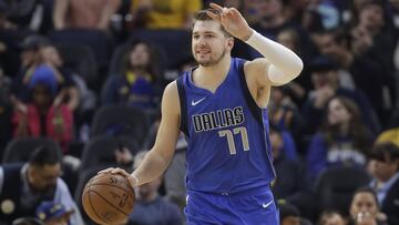 Dallas Mavericks forward Luka Doncic (77) dribbles upcourt against the Golden State Warriors during the first half of an NBA basketball game in San Francisco, Saturday, Dec. 28, 2019. (AP Photo/Jeff Chiu)