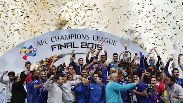 Members of Al-Hilal celebrate their victory and Asian club title on the podium following their 2-0 victory in the second leg of the AFC Champions League final football match between Japan&#039;s Urawa Red Diamonds and Saudix92s Al-Hilal in Saitama on Nove