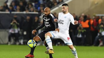 Marseille's Spanish defender Alvaro Gonzalez (R) vies with Bordeaux's French forward Jimmy Briand (L) during the French L1 football match between Girondins de Bordeaux (FCGB) and Olympique de Marseille (OM) on February 2, 2020, at the Matmut-Atl