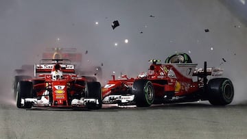 SINGAPORE - SEPTEMBER 17:  Sebastian Vettel of Germany driving the (5) Scuderia Ferrari SF70H and Kimi Raikkonen of Finland driving the (7) Scuderia Ferrari SF70H collide at the start during the Formula One Grand Prix of Singapore at Marina Bay Street Circuit on September 17, 2017 in Singapore.  (Photo by Lars Baron/Getty Images)